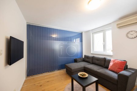 Photo for Interior of a living room with glass wall separating from bedroom - Royalty Free Image