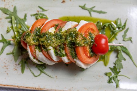 Photo for Caprese skewers with pesto sauce - Royalty Free Image