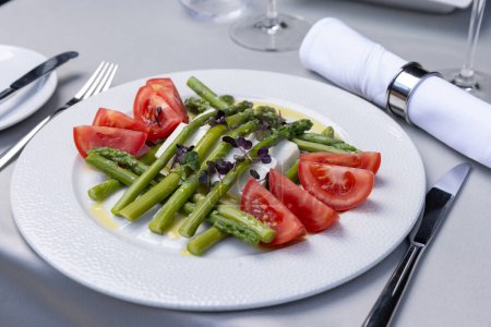Photo for Caprese salad with asparagus served on a plate - Royalty Free Image