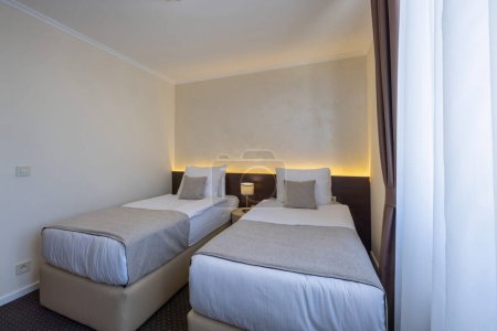 Photo for Small two bed hotel room interior - Royalty Free Image