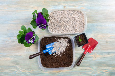 Mixing perlite granules pellets with black gardening soil improves water retention, airflow, aeration, root growth capacity of all the plants growing in pots.  Perlite is an amorphous volcanic glass.