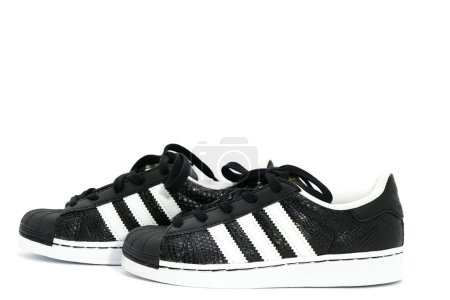 Photo for Bangkok ,Thailand,Jun 16 ,2018 14:07:45,Adidas Three strips decoration shoes in kid black size footware on isolated white - Royalty Free Image