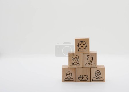 three generation ,grandparents,parents,mommy,daddy,child show in icons on minimal wood blocks in family generations together happiness concept