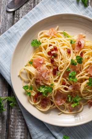 Photo for Delicious pasta with garlic, ham and parmesan - Royalty Free Image
