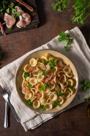 Photo for Delicious pasta with garlic, ham and parmesan - Royalty Free Image