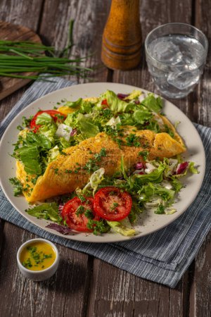 Photo for Delicious eggs omelette with salad and vegetable - Royalty Free Image