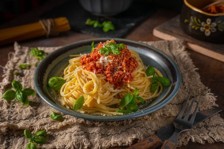 Photo for Delicious pasta with basil, parmesan cheese and bolognese sauce - Royalty Free Image