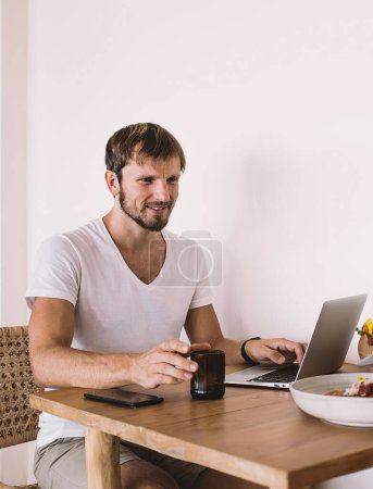 Photo for Caucasian couple in love discussing fresh ingredients of vegetable salad during lunch time in cafe interior with good internet connection for distance job via laptop device, concept of friendship - Royalty Free Image