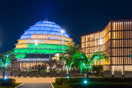 Photo for Kigali, Rwanda - August 19 2022: Kigali Convention Centre at night, lit up in the colors of the Rwandan flag. The facility is designed to host a variety of events and is a top attraction in the city. - Royalty Free Image