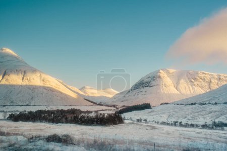 Mountains along the West Highland Way in Scotland, covered in snow, including Beinn Dorain (right) and Beinn a' Chaisteil (left)