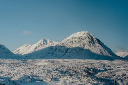Snow-covered Buachaille Etive Mor, an iconic mountain in the Scottish highlands 