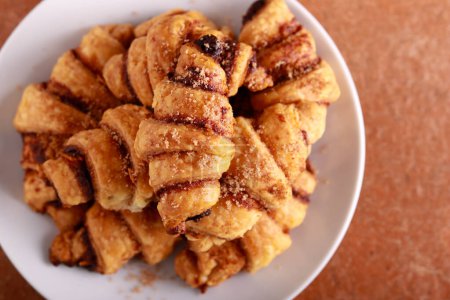 Photo for Sweet Rugelach with cinnamon and nuts, top view close up - Royalty Free Image