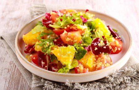 Foto de Healthy vitamin salad with orange and couscous - Imagen libre de derechos