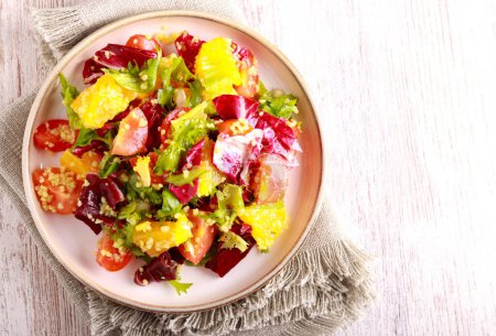 Photo for Healthy vitamin colorful salad with orange and couscous - Royalty Free Image