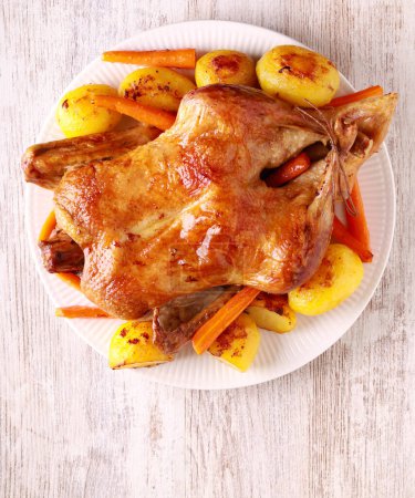 Photo for Roast whole duck with potatoes and carrot - Royalty Free Image