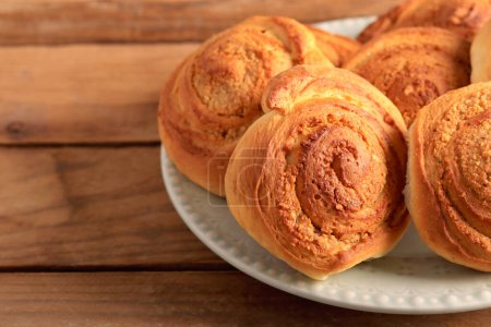 Photo for Nut filling swirl buns on plate - Royalty Free Image