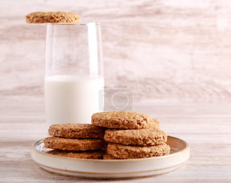 Photo for Oat and bran biscuits with glass of milk - Royalty Free Image