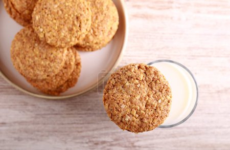Photo for Oat and bran biscuits with glass of milk - Royalty Free Image