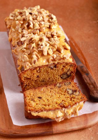 Photo for Carrot cake with caramel and walnut topping - Royalty Free Image