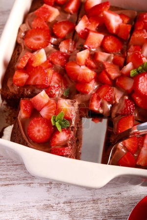 Photo for Chocolate cake with strawberry topping - Royalty Free Image