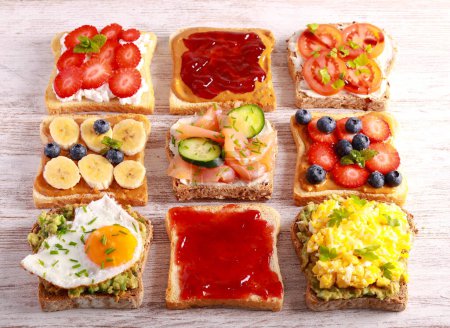 Photo for Selection of breakfast toasts with different toppings - savory and sweet. Sandwich, toasts mix, breakfast or brunch, concept - Royalty Free Image