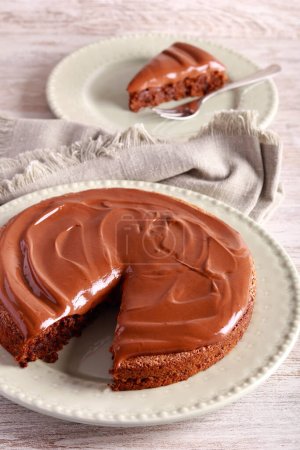 Photo for Mocha walnut cake with chocolate ganache topping - Royalty Free Image