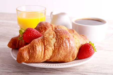 Photo for Breakfast set with croissants, orange juice and coffee - Royalty Free Image