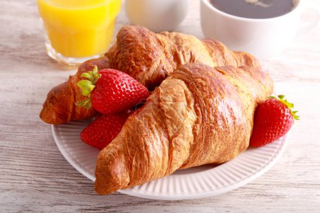 Photo for Breakfast set with croissants, orange juice and coffee - Royalty Free Image