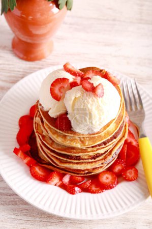 Photo for Pile of pancakes with ice cream on top - Royalty Free Image