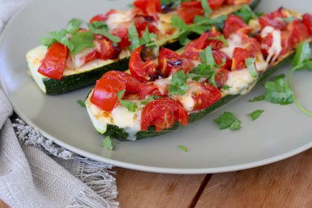 Photo for Baked zucchini with halloumi cheese and tomato - Royalty Free Image