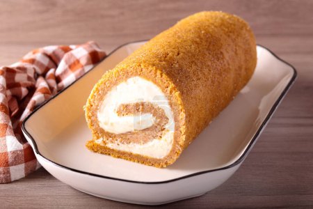 Photo for Pumpkin cake roll, on the plate - Royalty Free Image