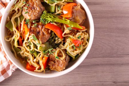Photo for Meatballs with noodles, broccoli, beans and pepper - Royalty Free Image