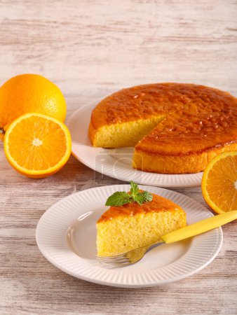 Photo for Orange cake, sliced and served - Royalty Free Image