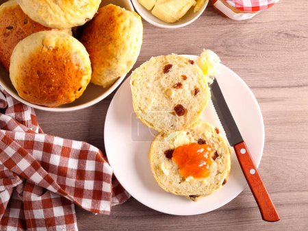 Photo for Homemade tea cakes served with butter and jam - Royalty Free Image