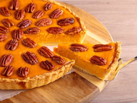 Photo for Pumpkin and pecan cheesecake pie - Royalty Free Image