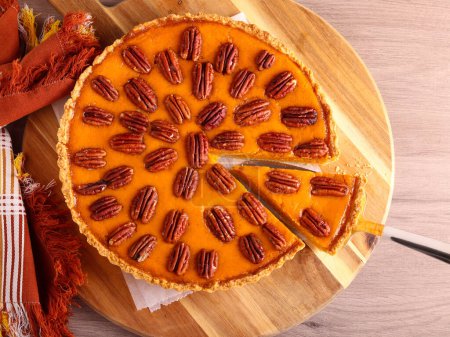 Photo for Pumpkin and pecan cheesecake pie - Royalty Free Image