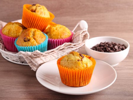 Photo for Homemade chocolate chip muffins, served - Royalty Free Image