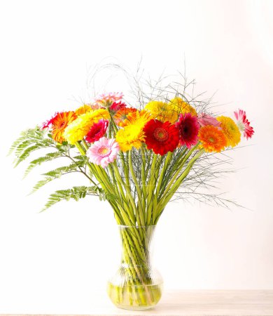 Photo for Bouquet of colourful flowers over white background - Royalty Free Image