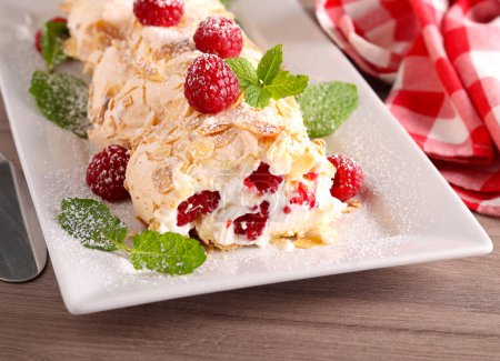 Photo for Raspberry merengue roulade, sweet roll with cream and raspberry - Royalty Free Image