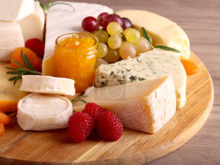 Photo for Assorted sorts of cheese on a cheese board - Royalty Free Image