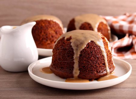 Photo for Sticky toffee pudding with caramel sauce - Royalty Free Image