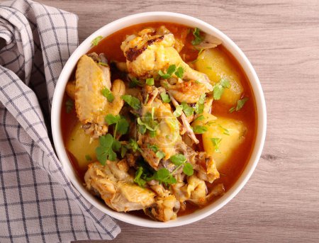 Photo for Spicy chicken and potato stew in a bowl - Royalty Free Image