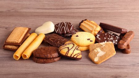 Photo for Mix of different cookies on wooden background - Royalty Free Image