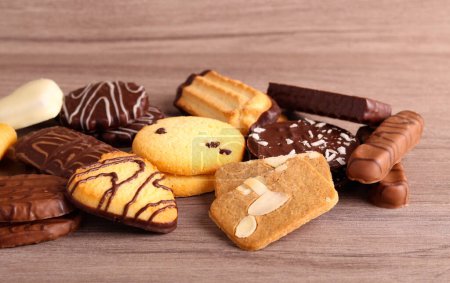 Photo for Mix of different cookies on wooden background - Royalty Free Image