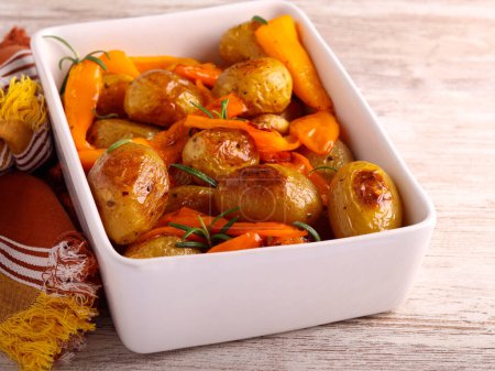 Photo for Roast potatoes with pepper in a tin - Royalty Free Image