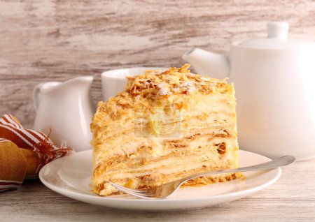 Slice of mille-feuille cake also called Napoleon cake or vanilla custard slice. Dessert made of puff pastry layered with pastry cream.