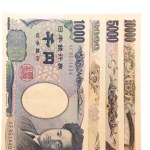 Bills of one thousand, two thousand, five thousand and ten thousand yen together on a white background. Money concept.