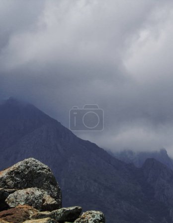 Photo for Rain bearing monsoon clouds over western ghats mountains in south india, in late summer season - Royalty Free Image