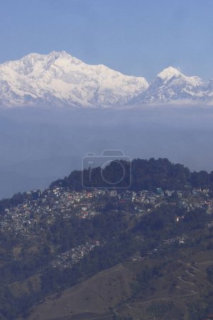 panorama of beautiful darjeeling hill station and snowcapped mount kangchenjunga, sleeping buddha range of himalaya mountains, west bengal in india