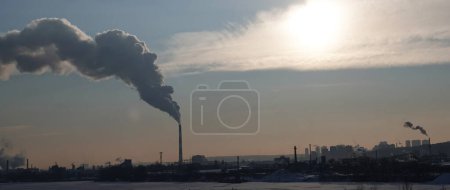 Photo for Kiev, Ukraine January 19, 2021: Chimneys smoke, polluting the air in the city worsening the environment - Royalty Free Image